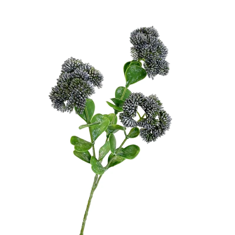 Dark artificial berry clusters on a green branching stem