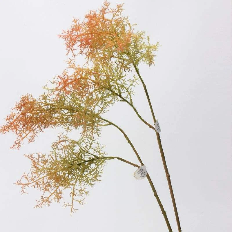 Fine orange and green artificial foliage on two long brown branches