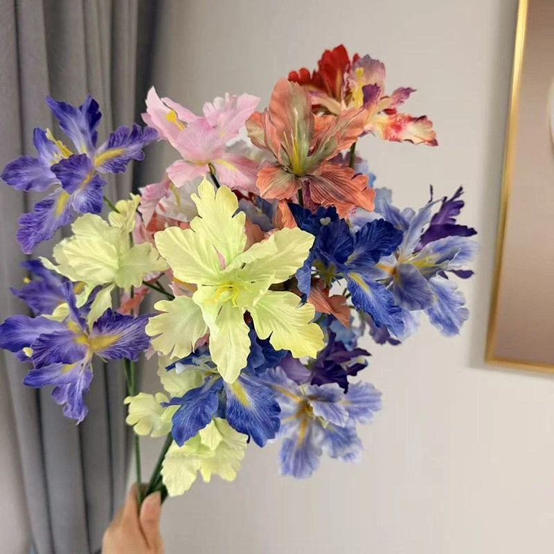 Purple, pale yellow, pink and orange artificial iris-style flowers held together